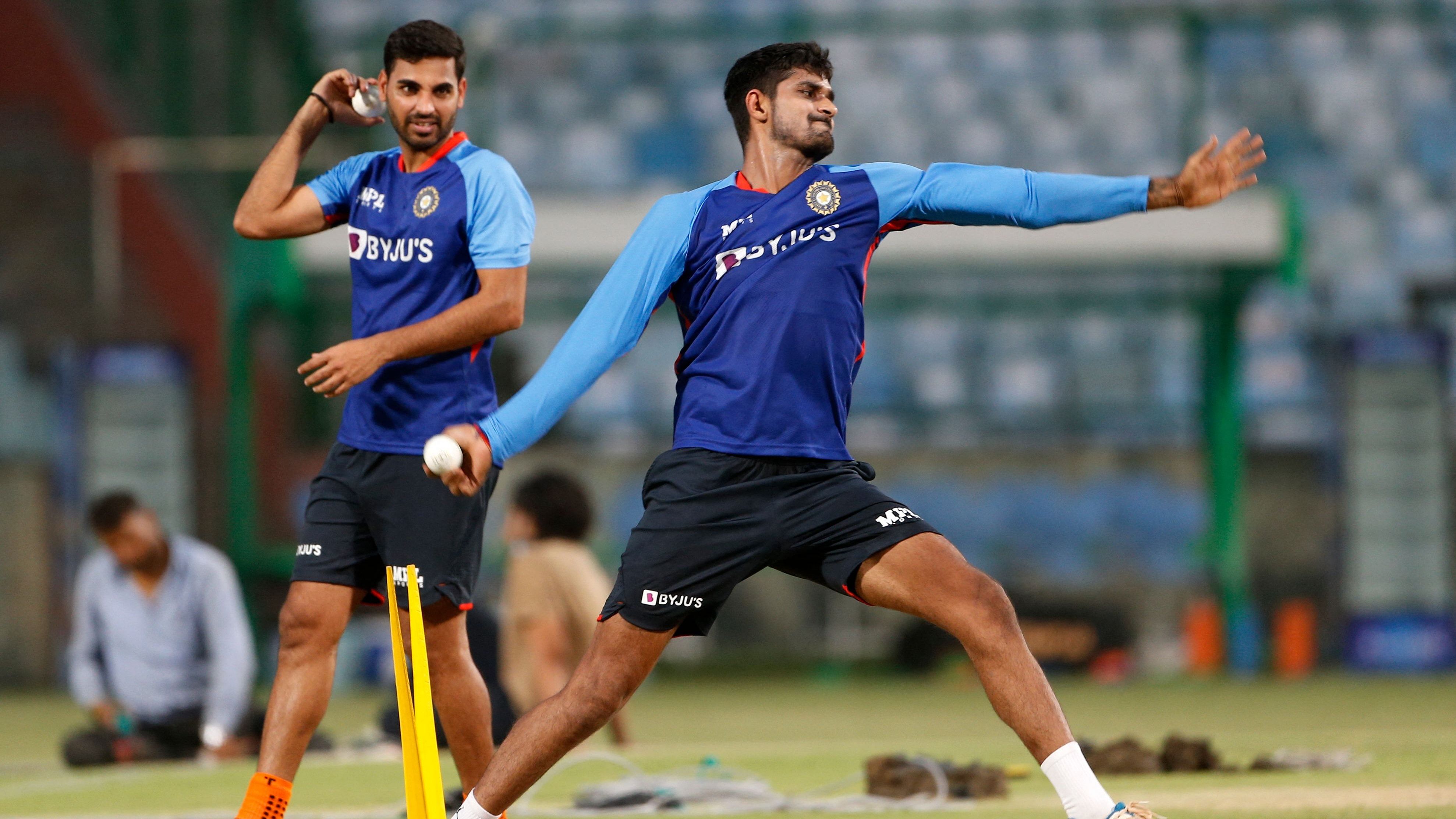  Bhuvneshwar Kumar (L) and Deepak Hooda attend a practice session at the Arun Jaitley Stadium in New Delhi. Credit: AFP Photo