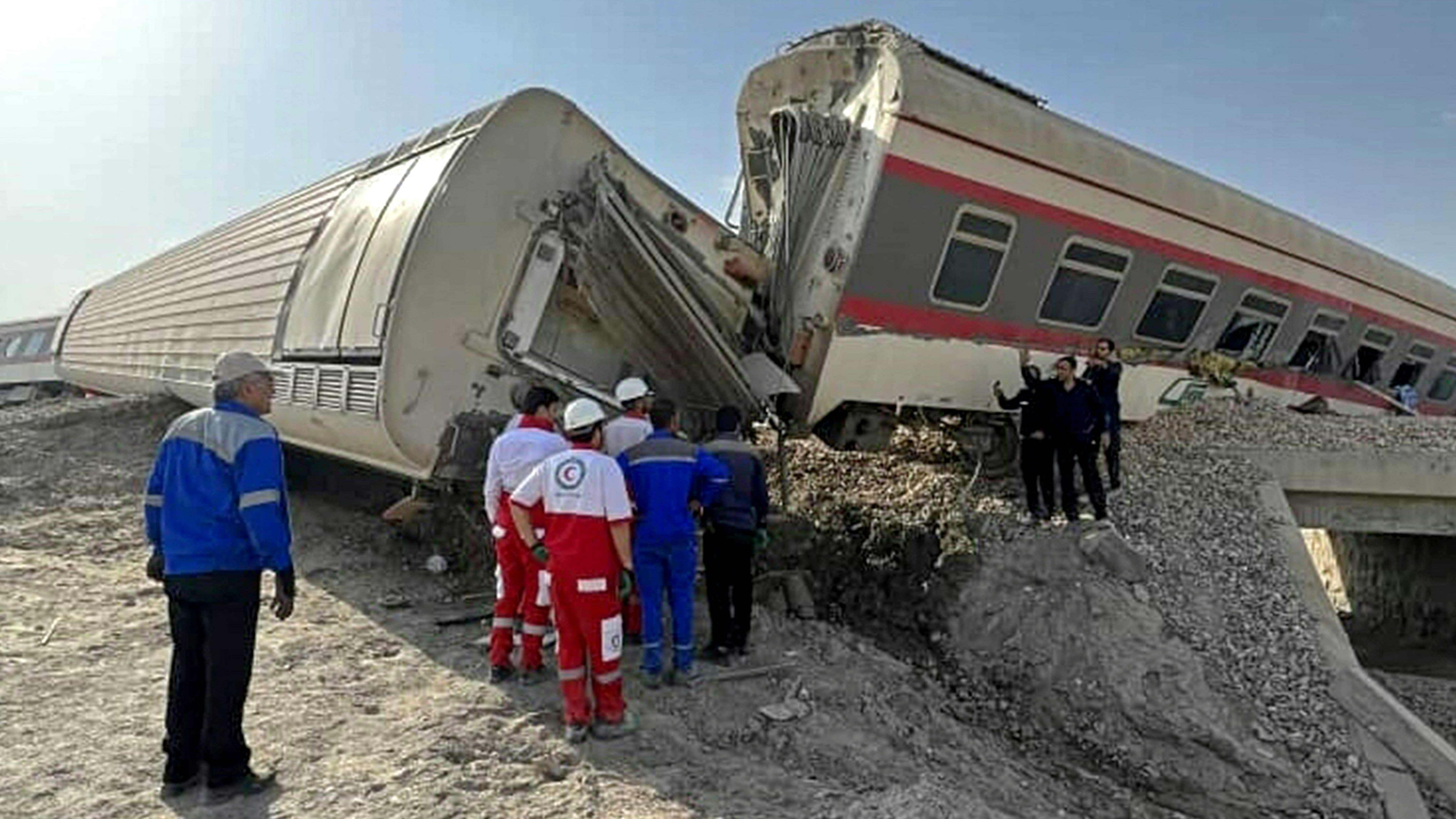 Four of the seven cars in the train derailed in the early morning darkness near the desert city of Tabas. Credit: AFP Photo