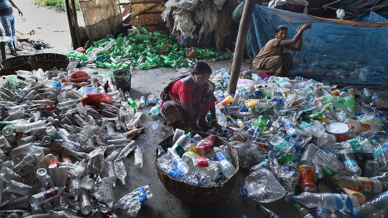 Workers segregate plastic waste for recycling purpose in Kolkata. Credit: PTI Photo