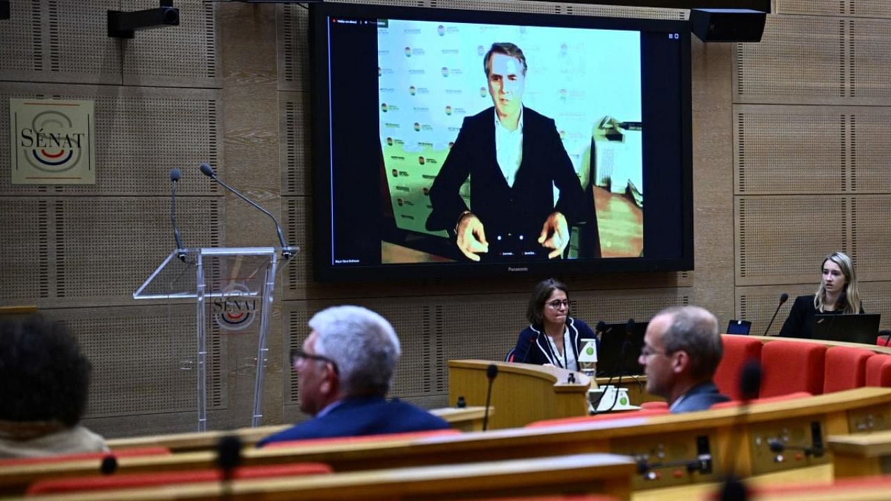 Liverpool's Mayor Steve Rotheram (back) is displayed on a screen during a senate hearing on the incidents which occurred at the Stade de France during the UEFA Champions League final, at the French senate in Paris. Credit: AFP Photo