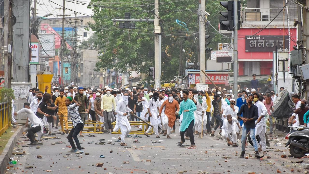 Miscreants throw stones on police during a protest over controversial remarks made by two now-suspended BJP leaders about Prophet Mohammed, in Ranchi. Credit: PTI Photo