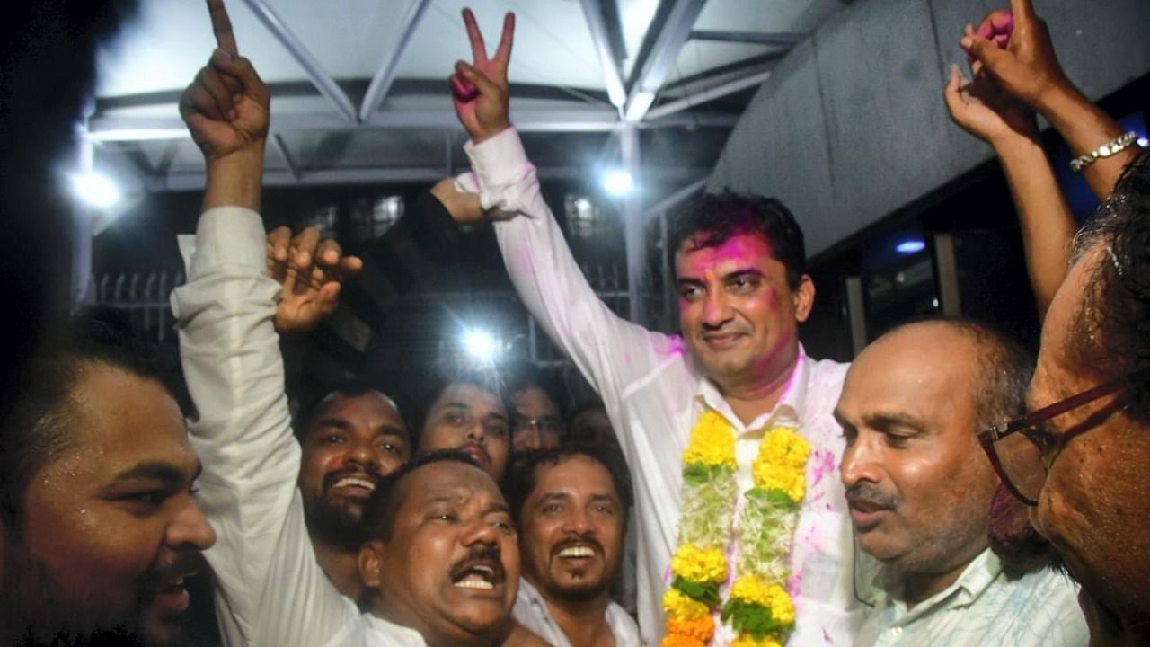 BJP winning candidate Dhananjay Bhimrao Mahadik celebrates with party workers after being elected as a member of Rajya Sabha from Maharashtra. Credit: PTI photo