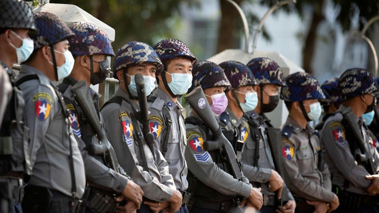 Police stand guard as they wait for protests against coup in Yangon. Credit: Reuters file photo