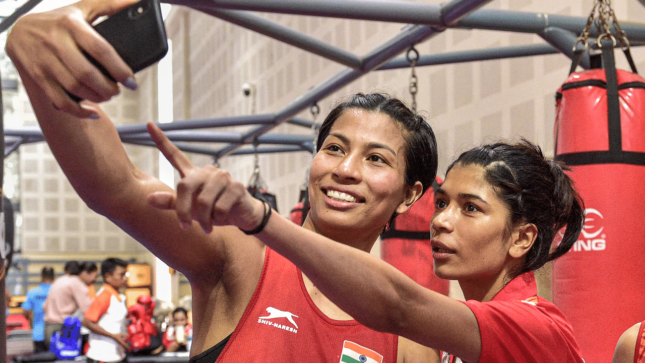 Boxers Lovlina Borgohain and Nikhat Zareen click a selfie after qualifying in the Elite Women Commonwealth Games (CWG) Trials 2022. Credit: PTI Photo