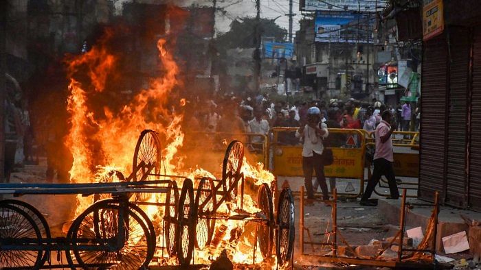 Carts set on fire by miscreants during a protest over controversial remarks made by two now-suspended BJP leaders about Prophet Mohammed, in Ranchi. Credit: PTI Photo