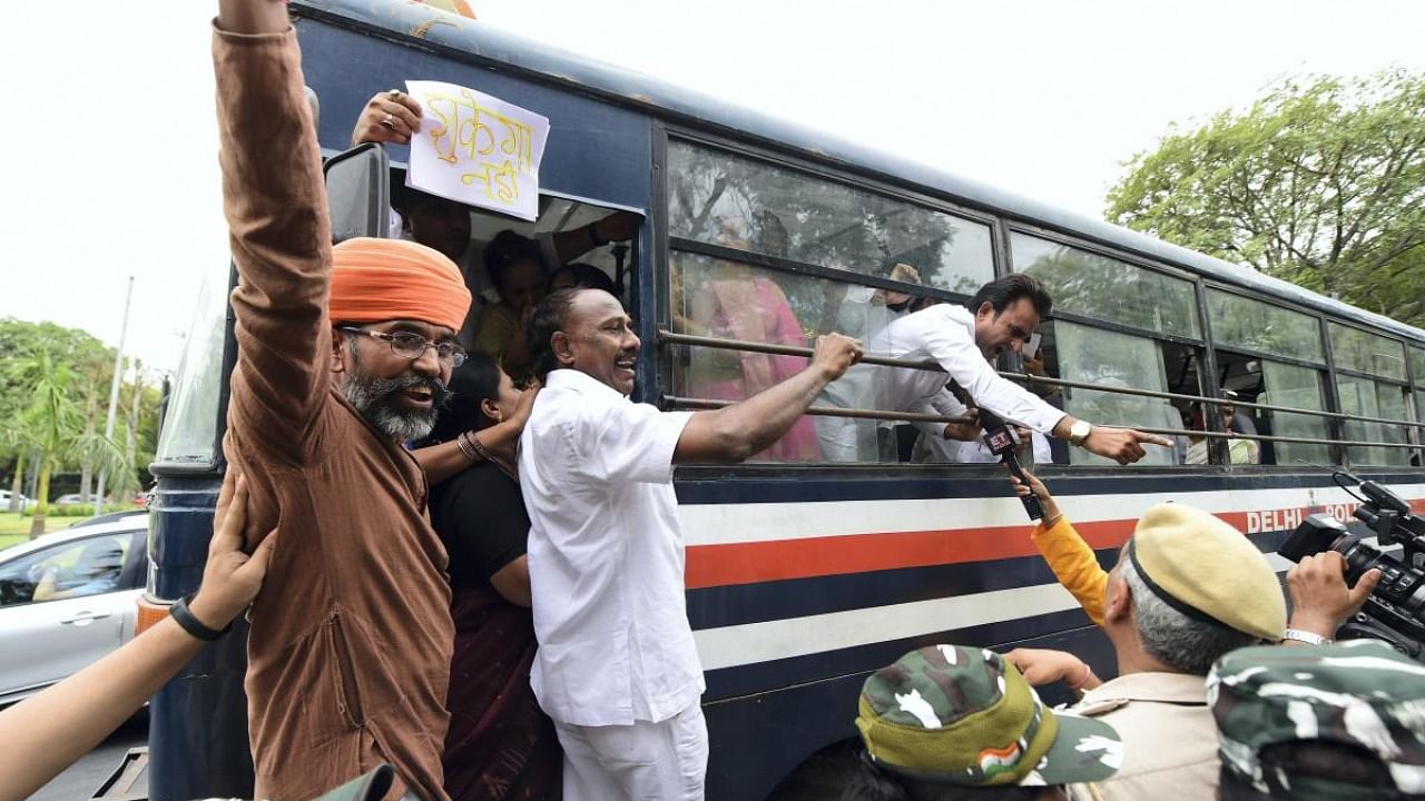 Congress activists being detained during a protest against summoning of the party's president Sonia Gandhi and party leader Rahul Gandhi in the National Herald case, in New Delhi, Monday, June 13, 2022. Credit: PTI Photo