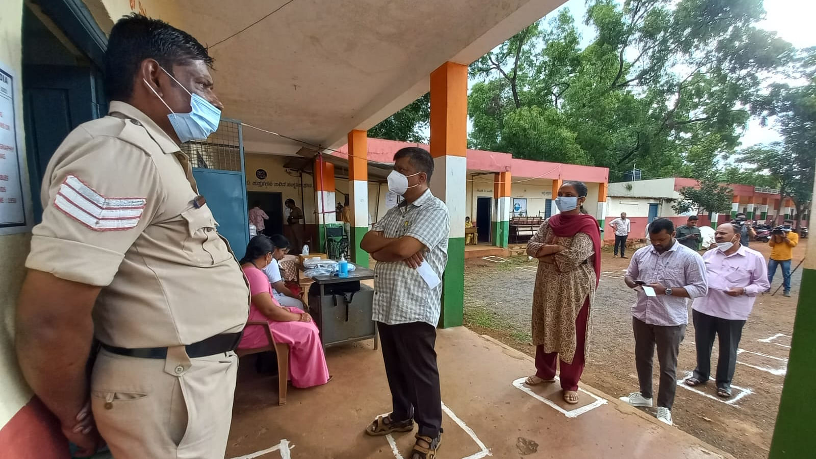 Voters lined up to cast their vote for the election for Legislative Council from North West Teachers Constituency and North West Graduates Constituency at polling station at Visvesvaraya Nagar in Belagavi on Monday. Credit: DH photo