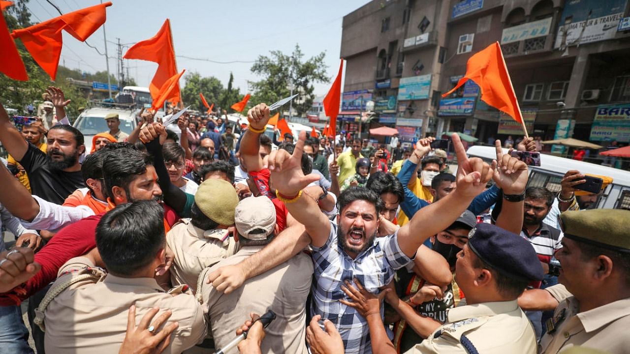 Bajrang Dal activists stage a protest, a day after clashes in Bhaderwah against recent remarks on Prophet Mohammad by two now-suspended BJP leaders, in Jammu, Saturday, June 11, 2022. Credit: PTI Photo