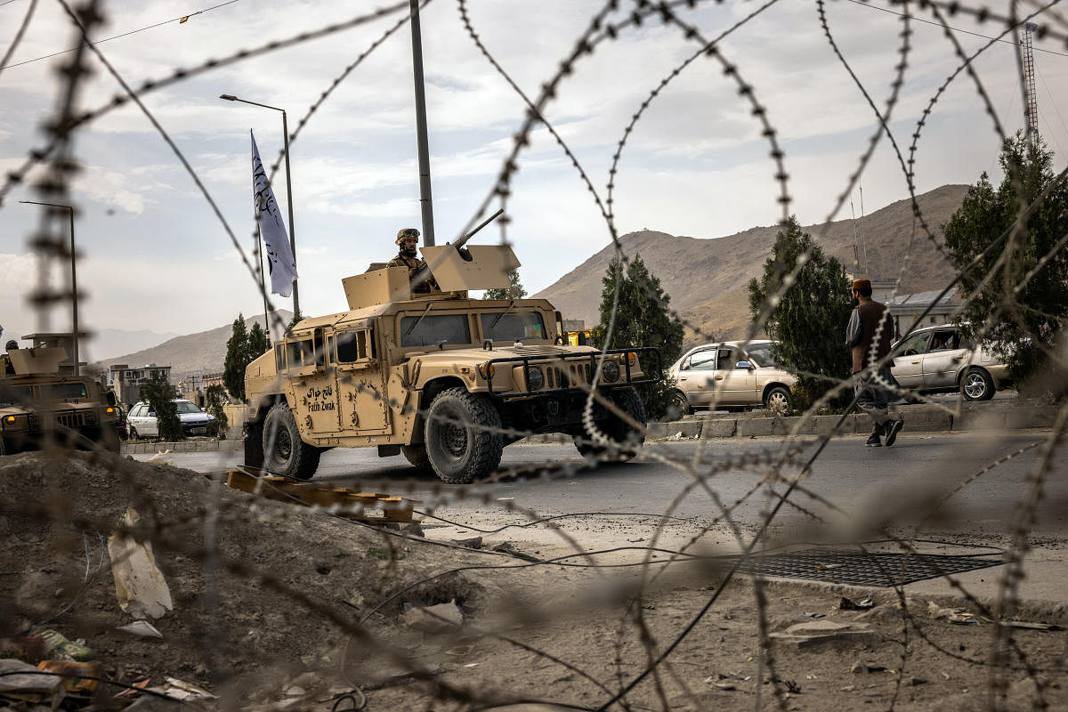 Taliban fighters patrol in a Humvee in Kabul on Friday, Sept. 3, 2021. (Jim Huylebroek/The New York Times)Taliban fighters patrol in a Humvee in Kabul. Credit: NYT Photo