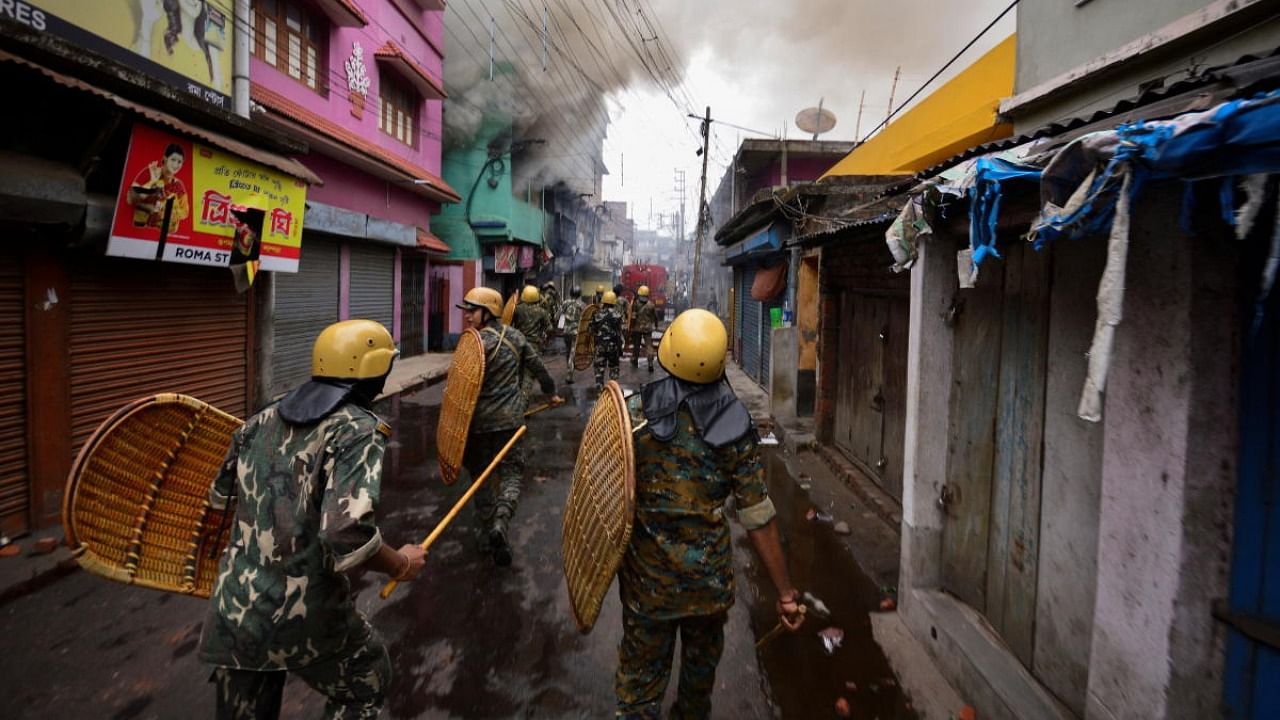 Security personnel patrols on a street after violence erupted between police and protestors over a comment on Prophet Mohammed by Bharatiya Janata Party (BJP) member Nupur Sharma, in Howrah on the outskirts of Kolkata. Credit: Reuters Photo