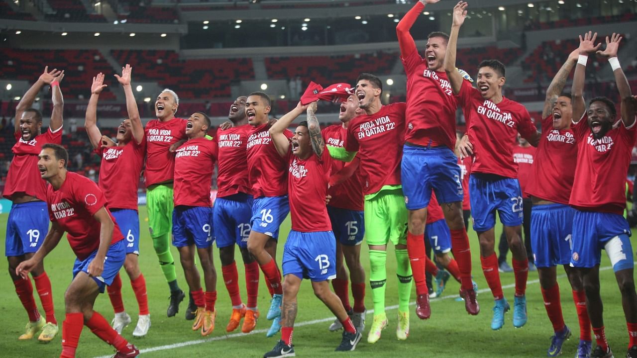 Costa Rica's players celebrate their win in the FIFA World Cup 2022 inter-confederation play-offs match between Costa Rica and New Zealand. Credit: Reuters Photo