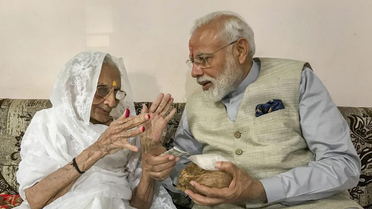 Prime Minister Narendra Modi being blessed by his nonagenarian mother Hiraba. Credit: PTI file photo