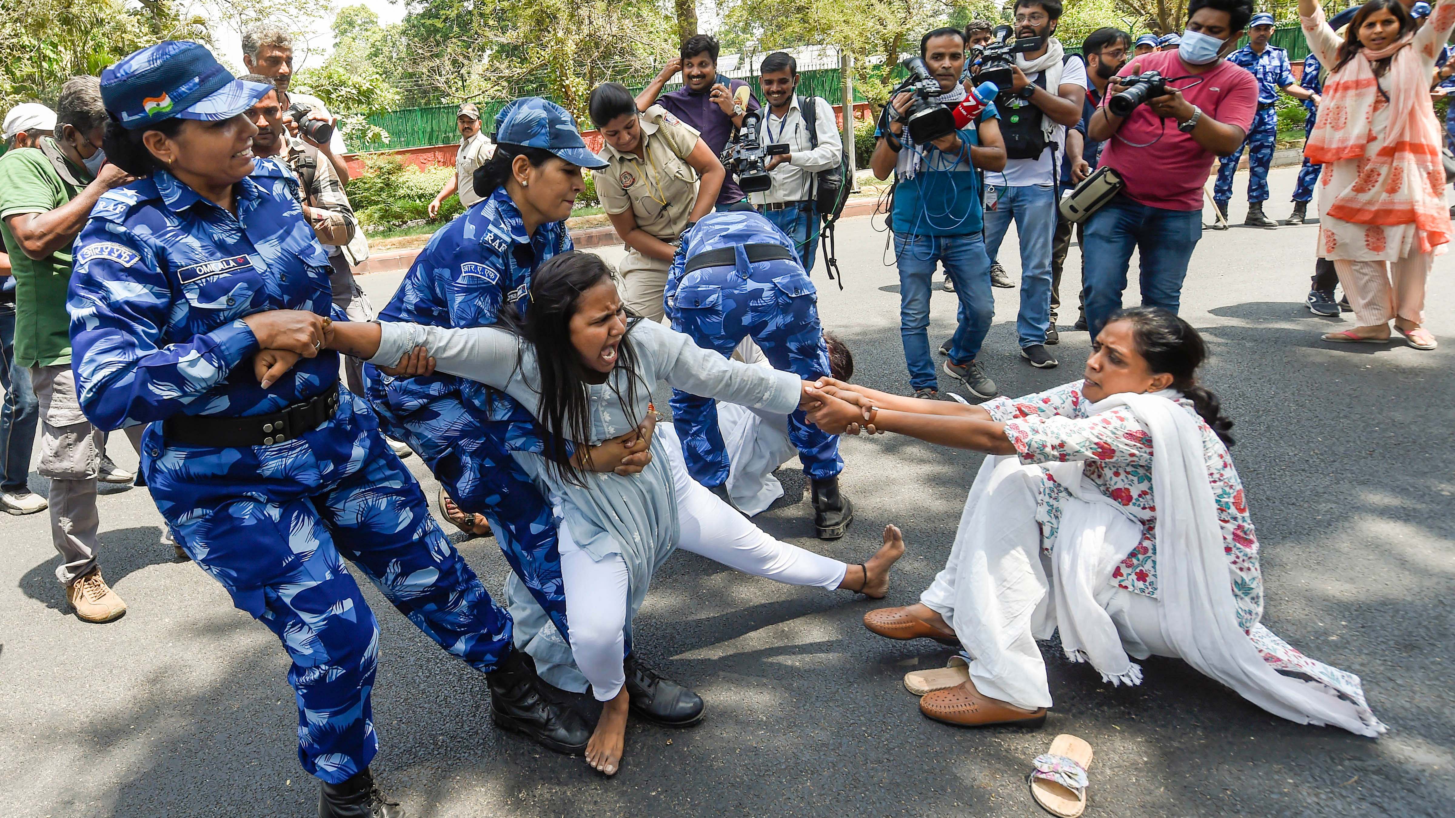 Police detain Congress workers during a protest outside the AICC office against summoning of party leader Rahul Gandhi by the Enforcement Directorate (ED) in connection with the National Herald case, in New Delhi. Credit:PTI Photo