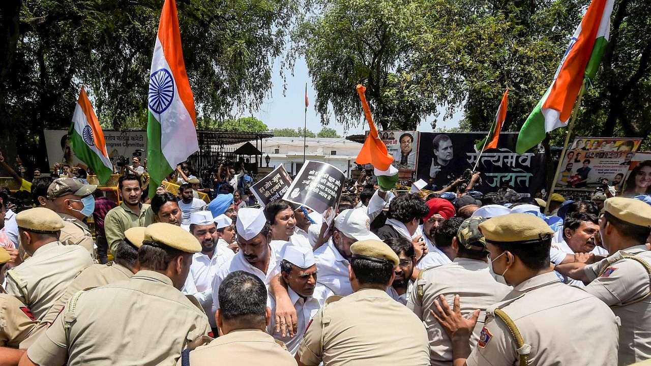 Police stop Congress workers during a protest outside the AICC office during against summoning of party leader Rahul Gandhi by the Enforcement Directorate (ED) in connection with the National Herald case, in New Delhi. Credit: PTI Photo