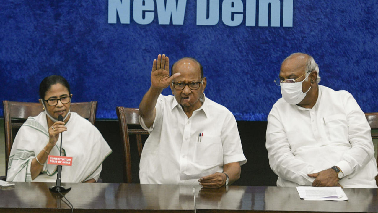 West Bengal Chief Minister and TMC Chief Mamata Banerjee, NCP Chief Sharad Pawar and Congress leader Mallikarjun Kharge during a press conference after the opposition leaders' meeting regarding upcoming Presidential elections. Credit: PTI Photo