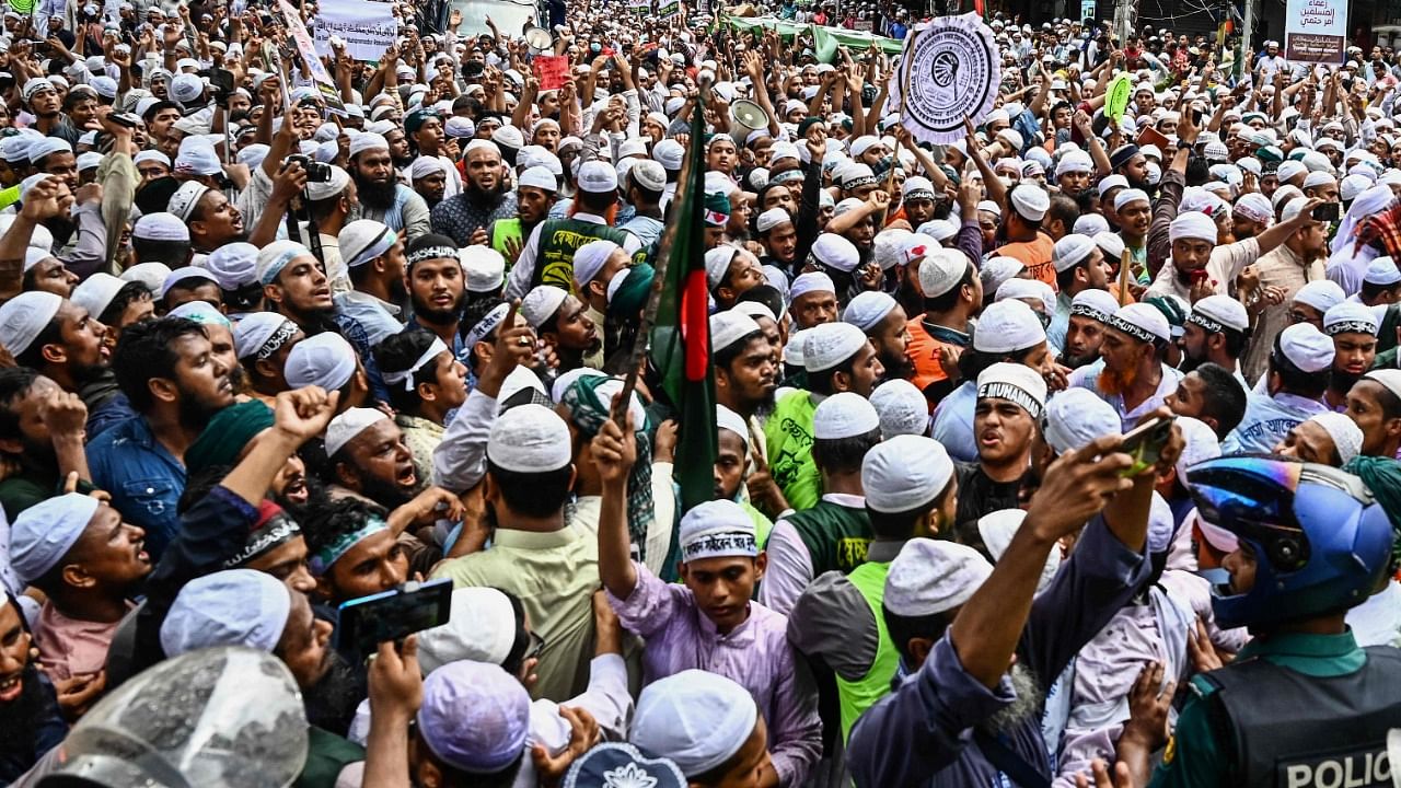 Police stop activists and supporters as they try to march towards the Indian embassy in Dhaka to protest against Prophet Mohammed remarks. Credit: AFP Photo