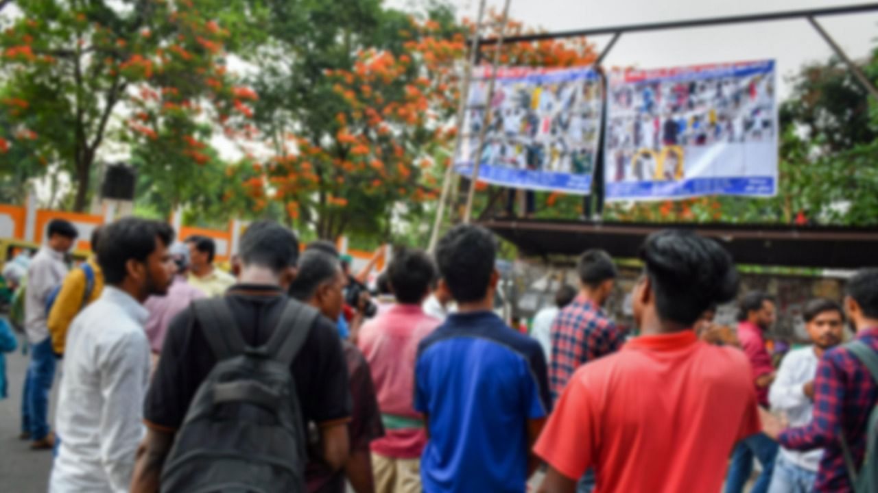 People look at the banners with photographs of alleged miscreants involved in violence during Friday's protests, in Ranchi, Tuesday, June 14, 2022. Credit: PTI Photo