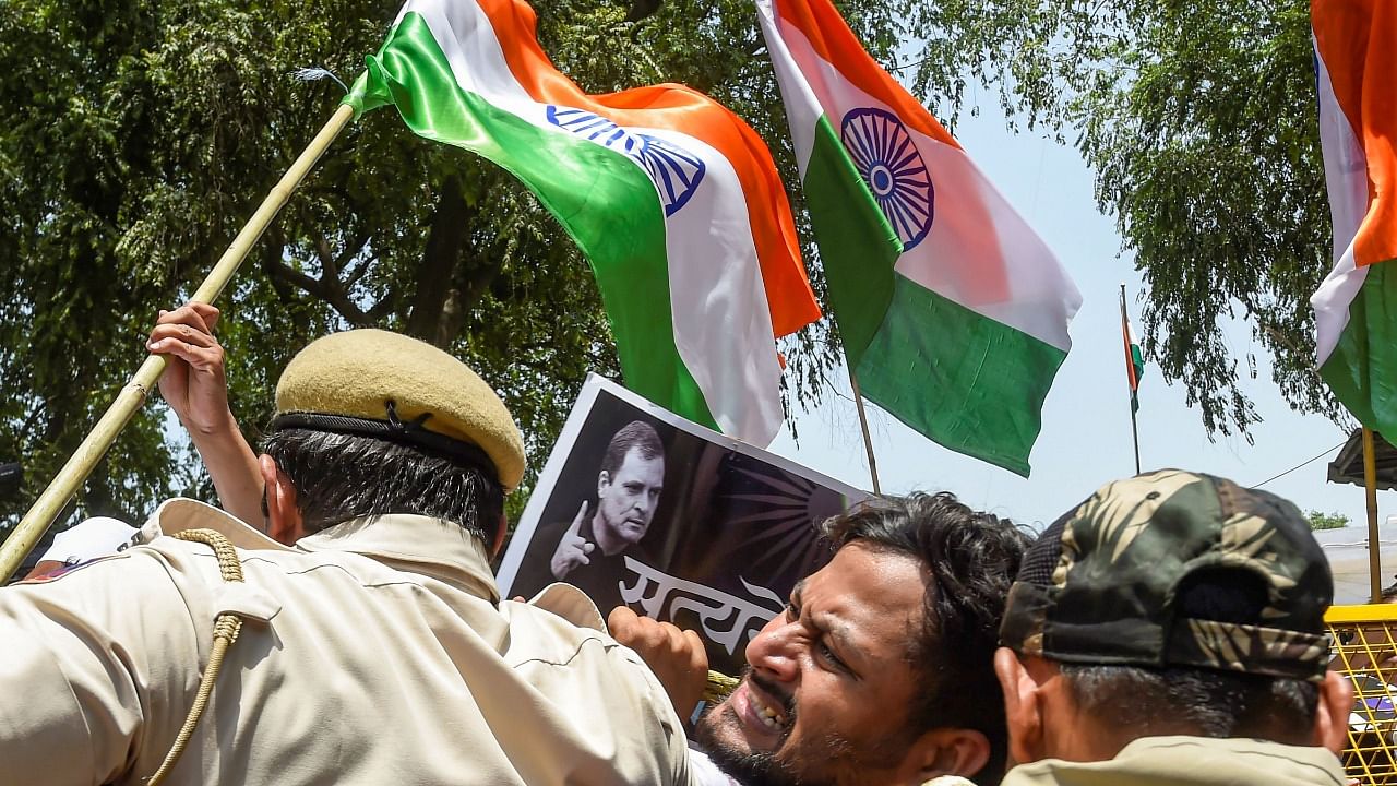 Police detain Congress workers during a protest outside the AICC office during against summoning of party leader Rahul Gandhi by the Enforcement Directorate (ED) in connection with the National Herald case. Credit: PTI Photo