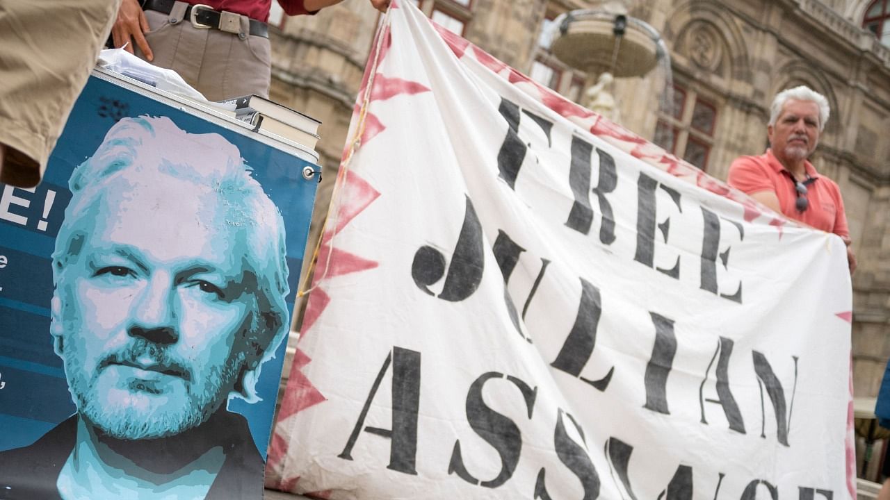Supporters of WikiLeaks founder Julian Assange attend a small protest near the State opera in Vienna, Austria. Credit: AFP Photo