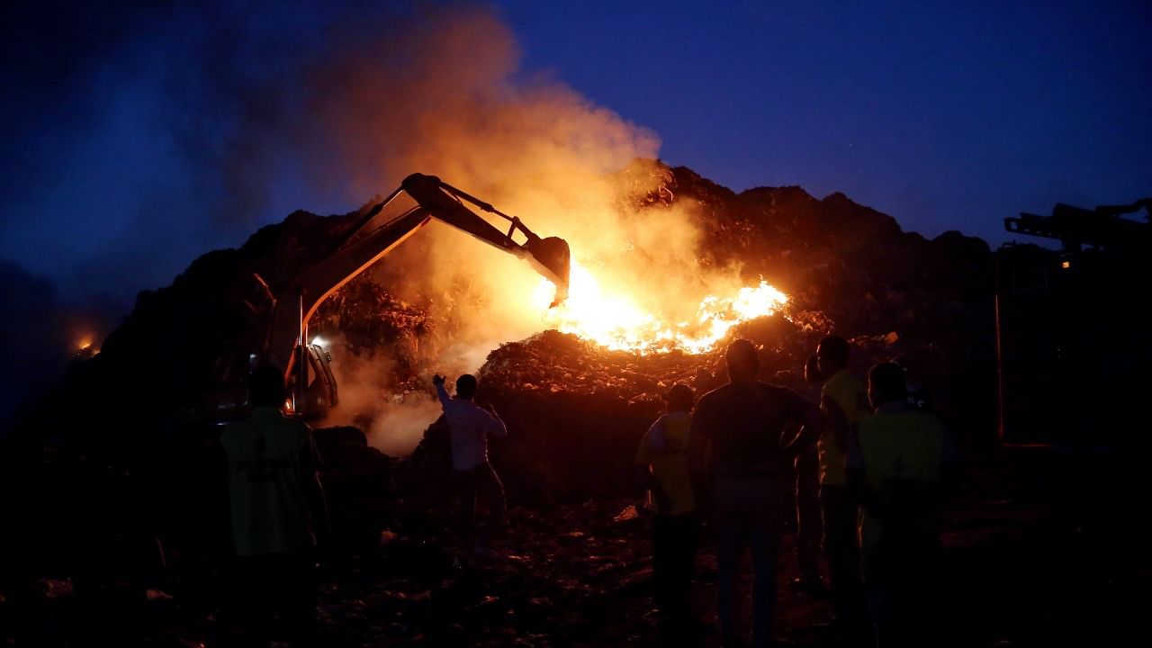 The fire occurred in fresh municipal solid waste around 5:30 pm at the top of the dumpsite on the side facing the Delhi-Chandigarh national highway. Credit: PTI Photo