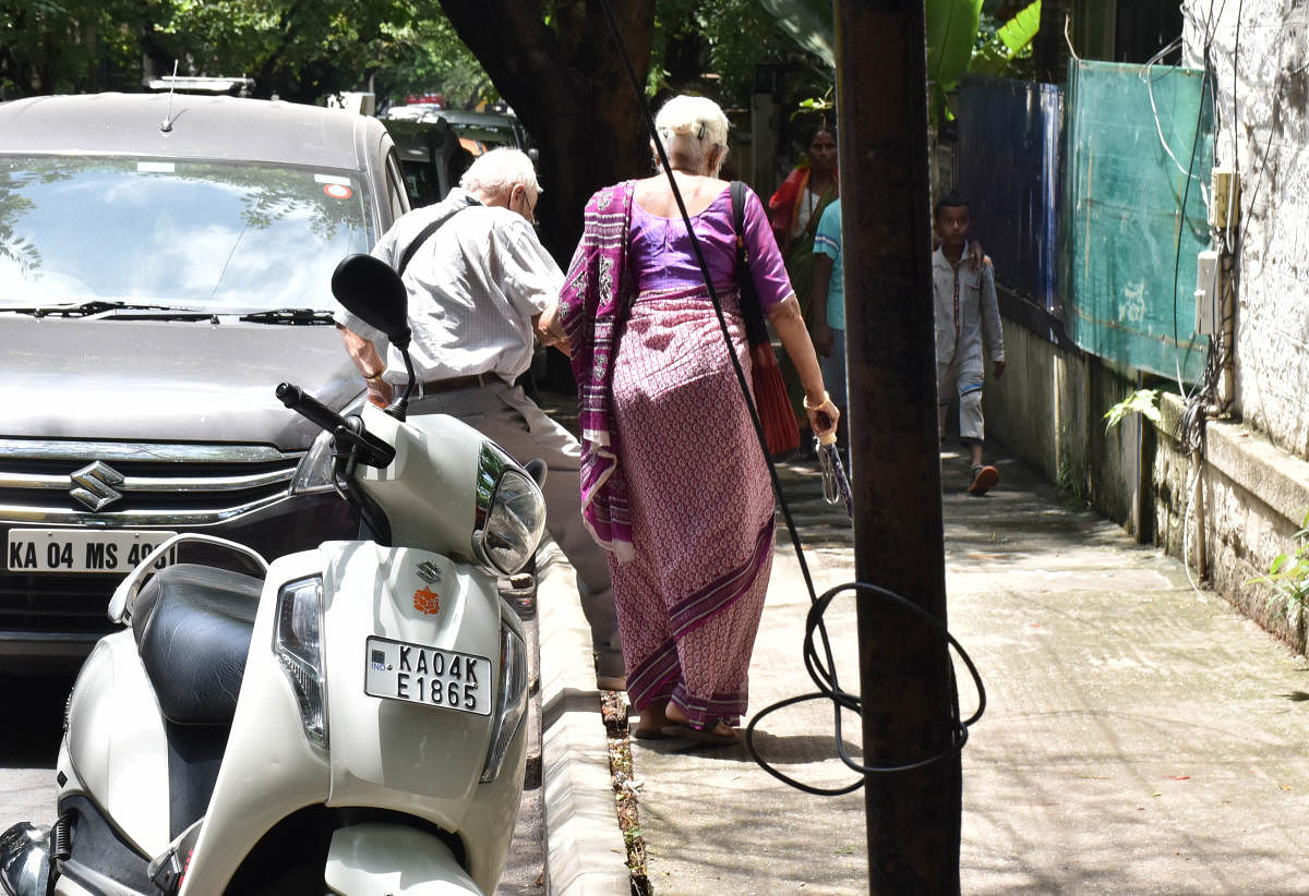 In most places, people park their vehicles on the roadsides or on the footpaths, creating a big hurdle for pedestrians, mainly for the differently abled. Credit: DH Photo