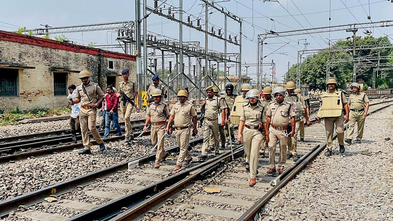 Police patrol along railway tracks a day after violent protest over Agnipath scheme, in Varanasi. Credit: PTI Photo