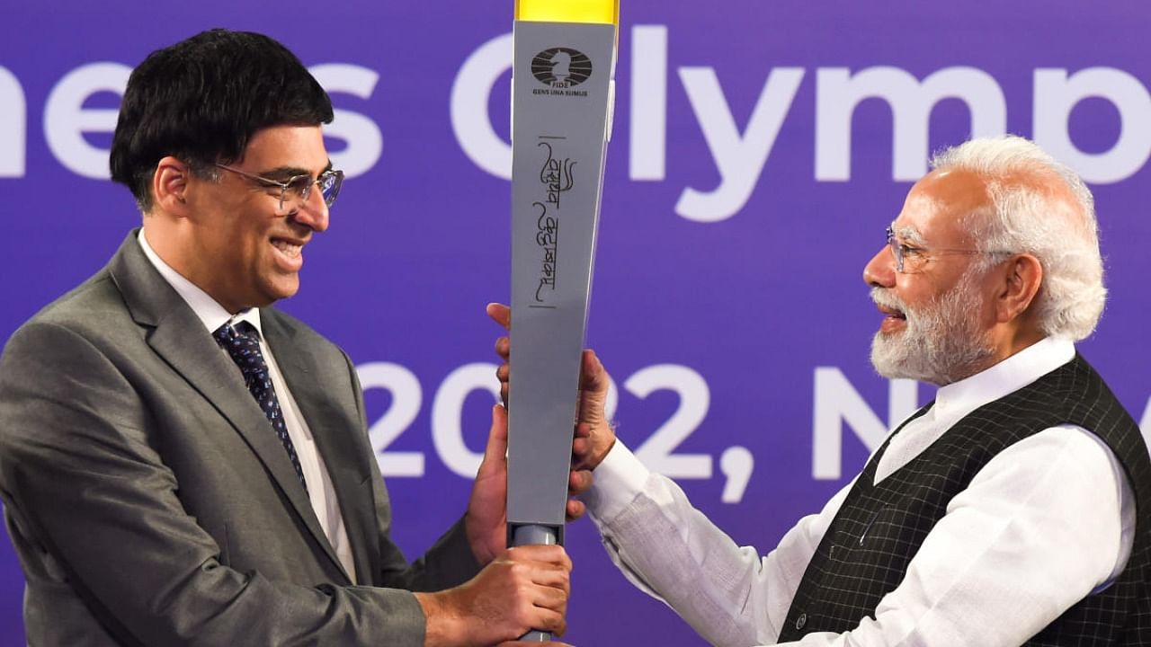 Prime Minister Narendra Modi with Indian chess grandmaster Viswanathan Anand during the launch of torch relay for 44th Chess Olympiad. Credit: PTI Photo