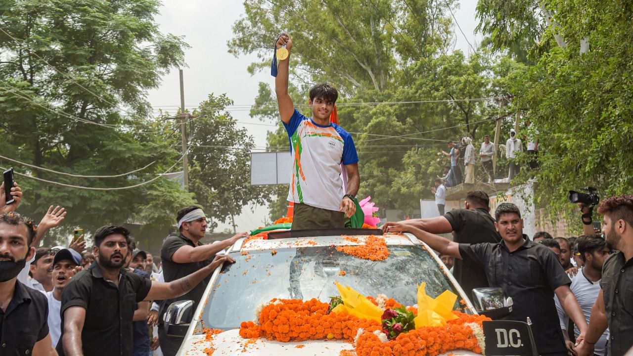 Olympic gold medalist athlete Neeraj Chopra being welcomed on his arrival at his native village Khandra in Panipat. Credit: PTI File Photo