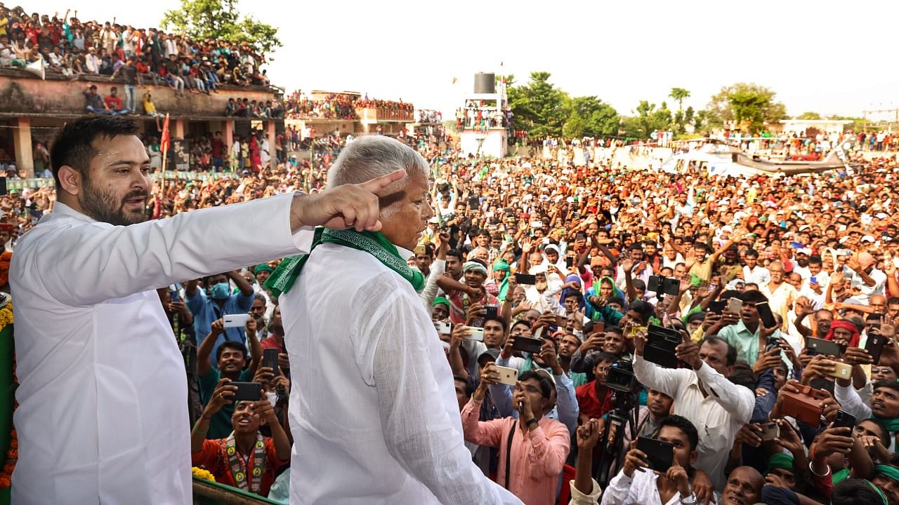 Rashtriya Janata Dal (RJD) chief Lalu Prasad Yadav along with son and party leader Tejashwi Yadav. Credit: PTI Photo