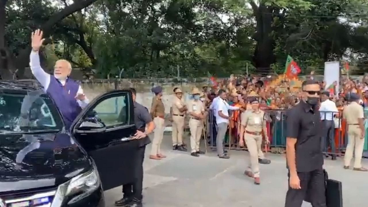 Modi waves at the crowd. Credit: IANS Photo