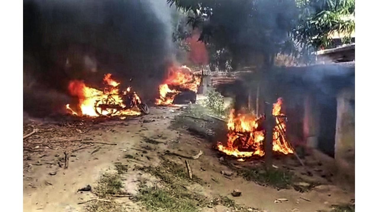 Vehicles after they were set on fire by protestors during the Bihar Bandh, called to protest against Centre's 'Agnipath' scheme, in Masaurhi, Saturday, June 18, 2022. Credit: PTI Photo