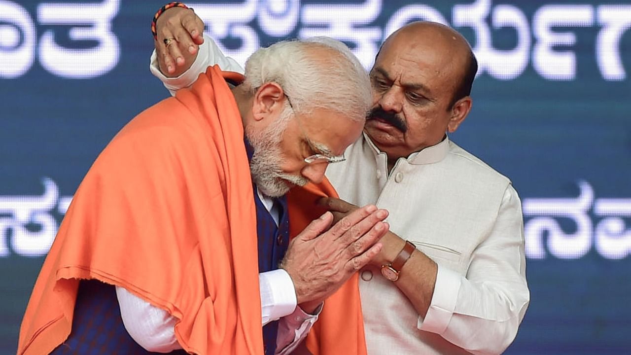 Prime Minister Narendra Modi being felicitated by Karnataka CM Basavaraj Bommai during the launch of railway and road projects, in Bengaluru, Monday, June 20, 2022. Credit: PTI Photo