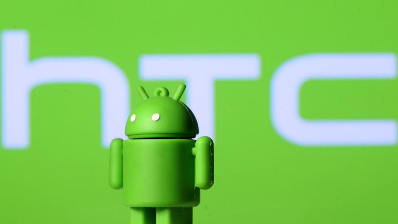 A 3D printed Android mascot Bugdroid is seen in front of an HTC logo in this illustration taken September 21, 2017. Credit: Reuters Photo