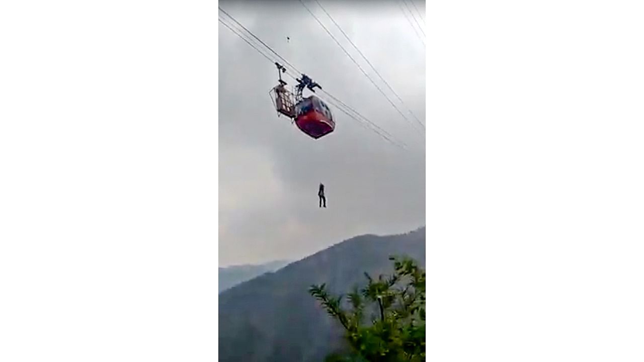 Rescue operation underway after a cable-car with tourists got stuck mid-air, at Parwanoo. Credit: PTI Photo