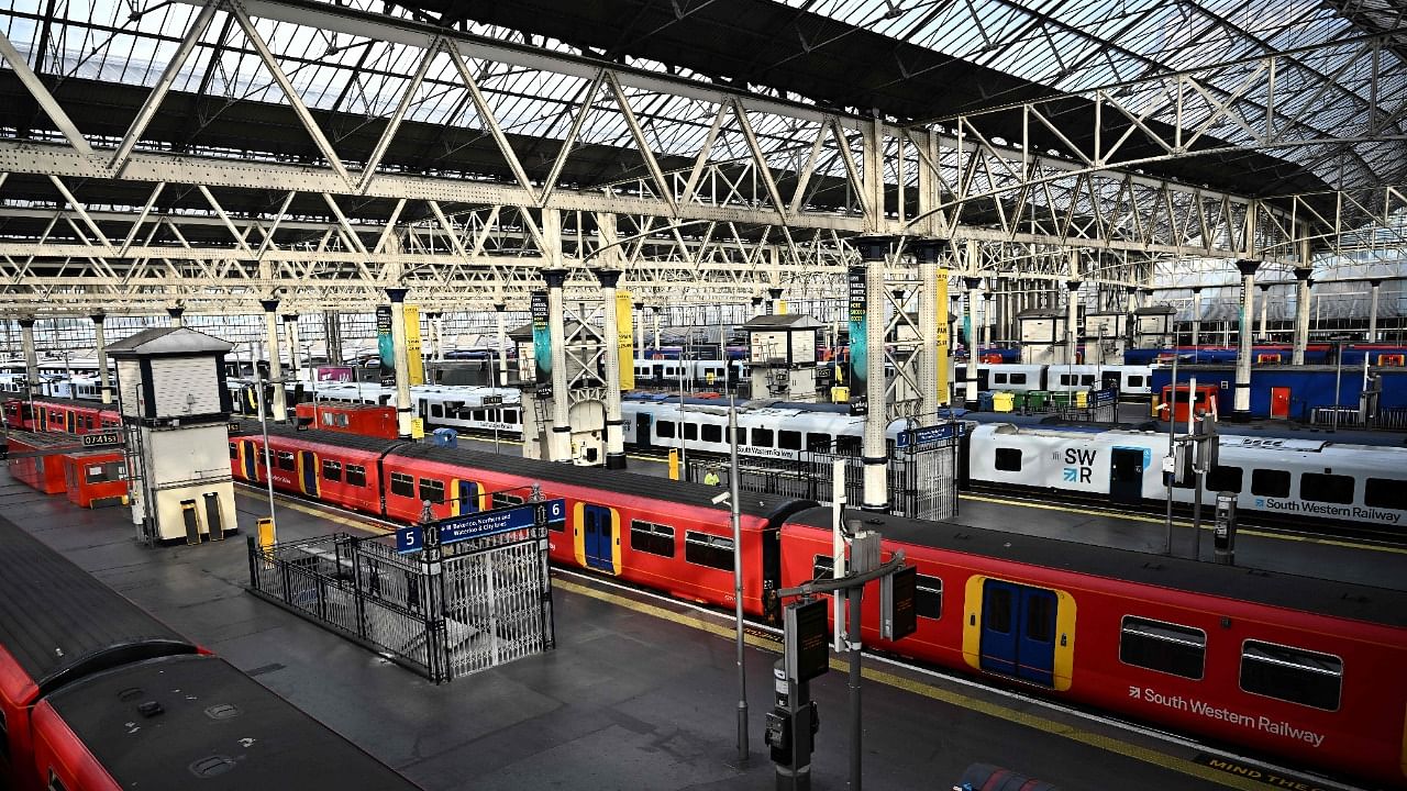 Empty platforms and trains are pictured at Waterloo Station in London as the biggest rail strike in over 30 years hits the UK. Credit: AFP Photo