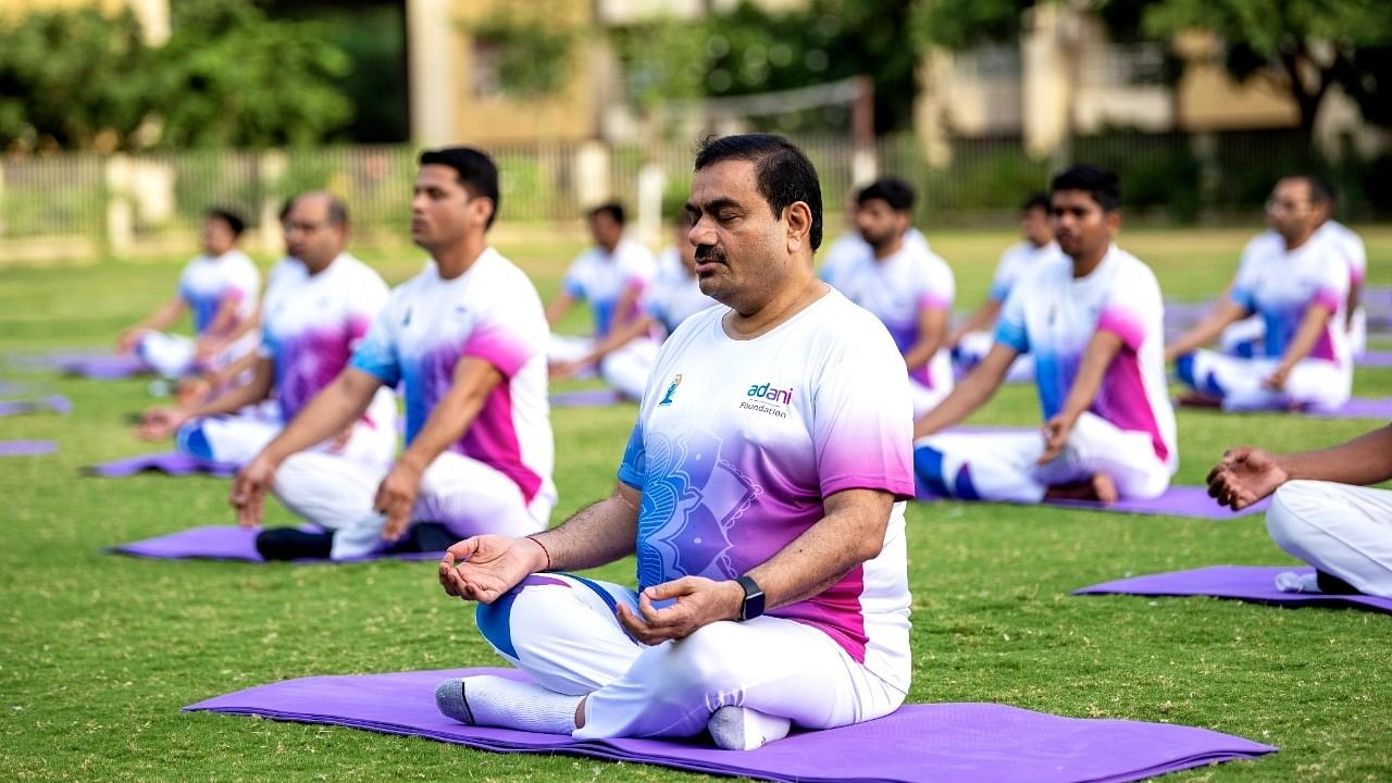 Billionaire Gautam Adani performs Yoga on behalf of International Yoga Day. Credit: Twitter/