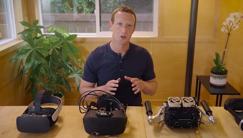 Meta co-founder Mark Zuckerberg showing off new VR headgear prototypes on Facebook (screen-grab)
