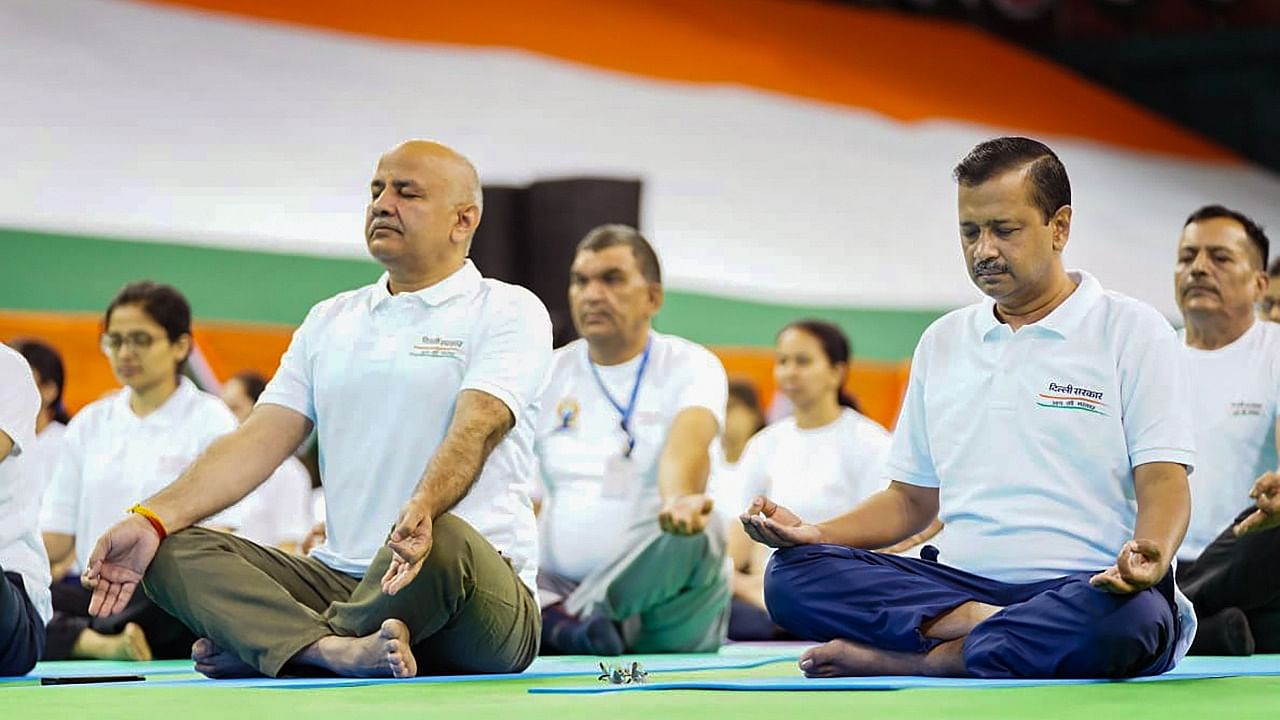 Delhi Chief Minister Arvind Kejriwal along with Dy CM Manish Sisodia and others performs yoga at the Thyagaraj Stadium to celebrate the International Day of Yoga, in New Delhi. Credit: Twitter/@msisodia