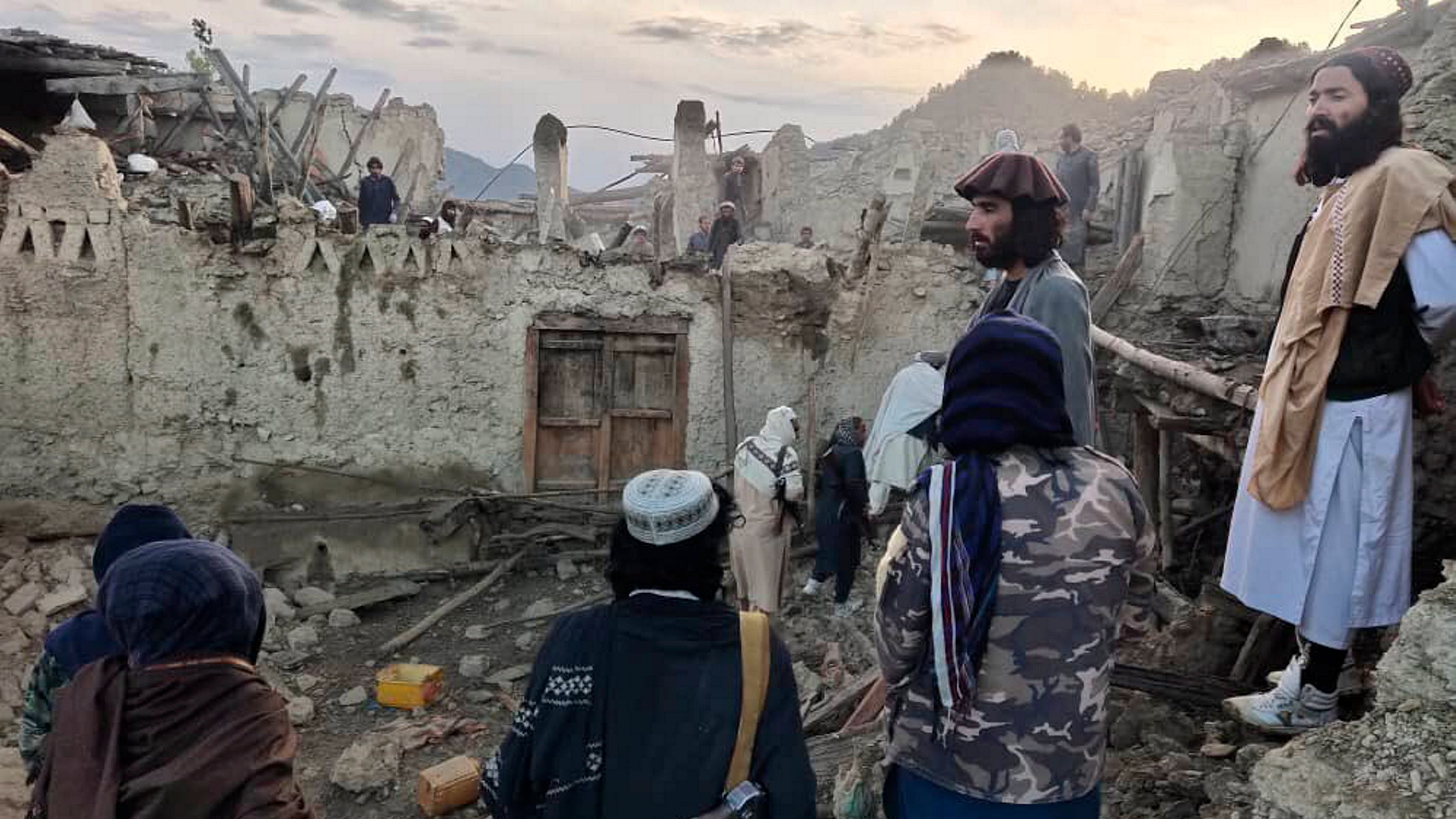 Afghans look at destruction caused by an earthquake in the province of Paktika. Credit: AP Photo