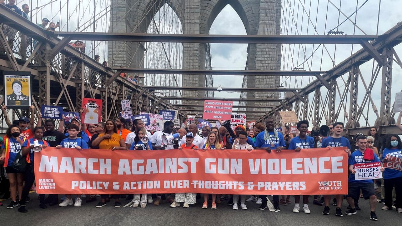 People cross the Brooklyn Bridge as they attend "March for Our Lives" rally, one of a series of nationwide protests against gun violence, New York. Credit: Reuters file photo