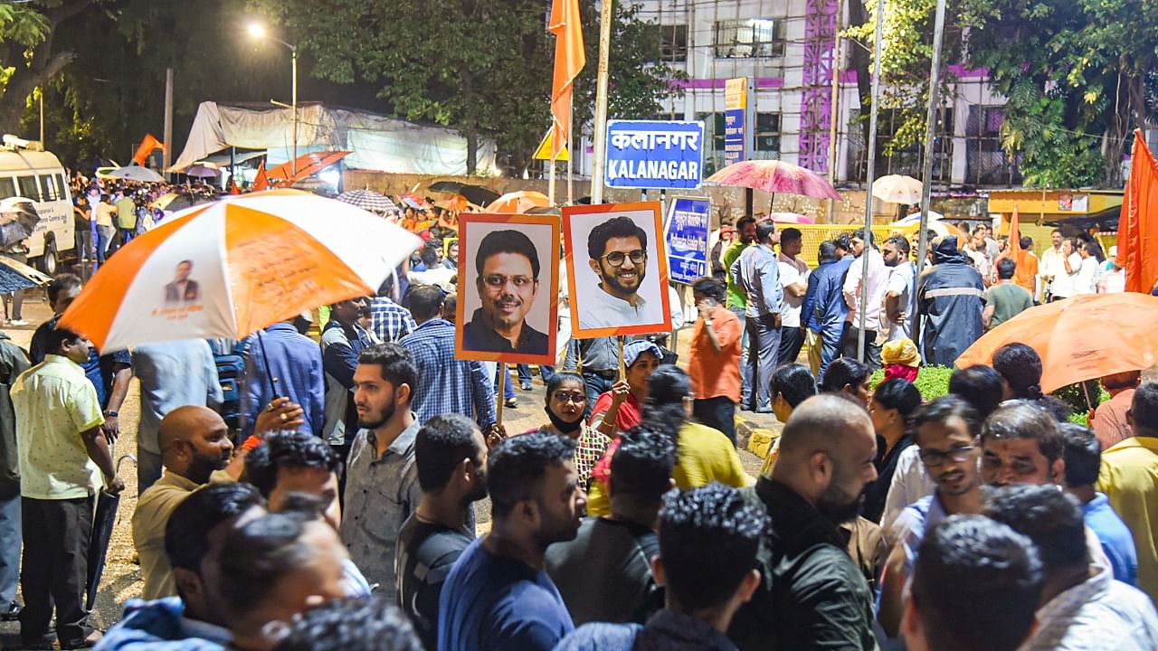 Shiv Sena workers gather outside 'Matoshree', the private residence of Maharashtra CM Uddhav Thackeray, to show their support. Credit: PTI Photo