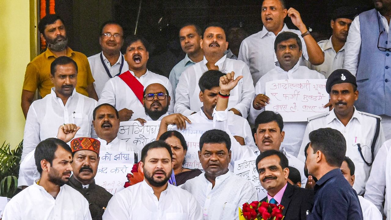  RJD leader Tejashwi Yadav along with party legislators stages a protest over the Agnipath Scheme on the first day of the Monsoon session of the Assembly, in Patna