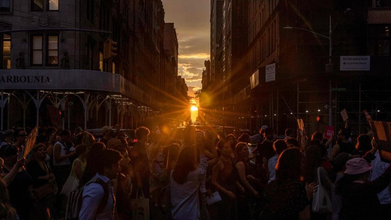 The sun sets on abortion rights activist marching from Washington Square Park to Bryant Park in protest of the overturning of Roe Vs. Wade by the US Supreme Court. Credit: AFP Photo