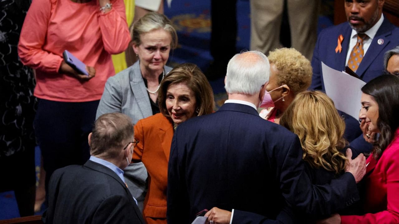 US Speaker of the House Nancy Pelosi (D-CA) celebrates along with other US House of Representatives Democrats after the passing of the "Bipartisan Safer Communities Act" gun safety legislation already passed by the US Senate. Credit: Reuters photo