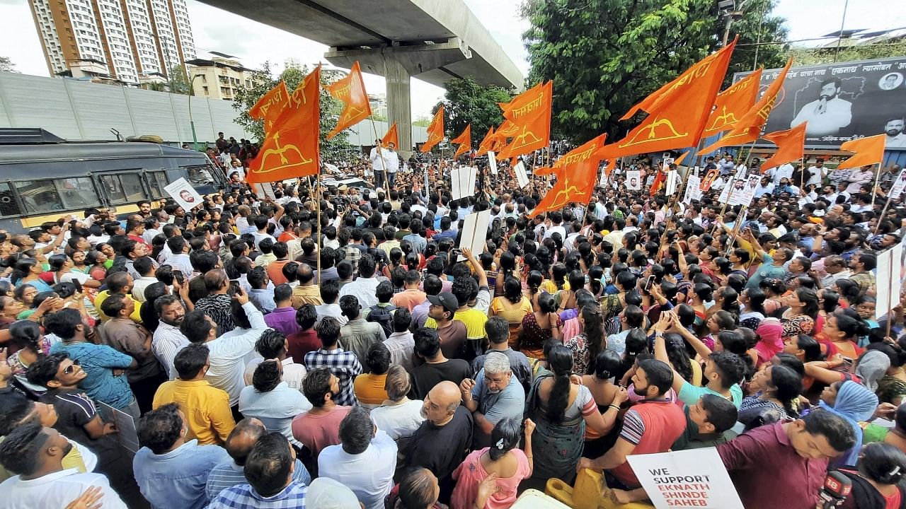 Supporters of rebel Shiv Sena leader Eknath Shinde gather outside his residence in Thane, Saturday, June 25, 2022. Credit: PTI Photo