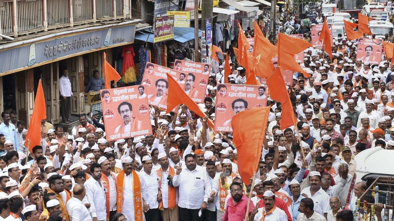 Shiv Sena workers take part in a protest rally against rebel Shiv Sena leader Eknath Shinde. Credit: PTI Photo