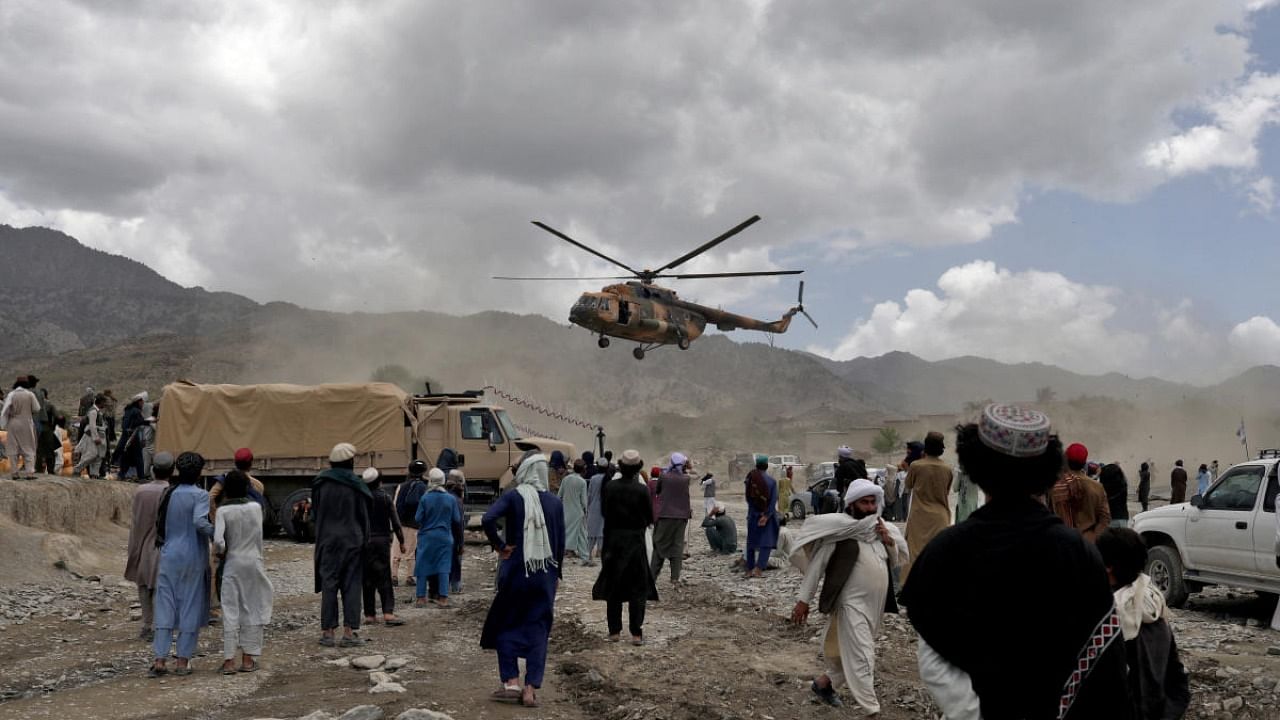 A Taliban helicopter carrying aid lands in an earthquake affected area in Gayan. Credit: Reuters photo