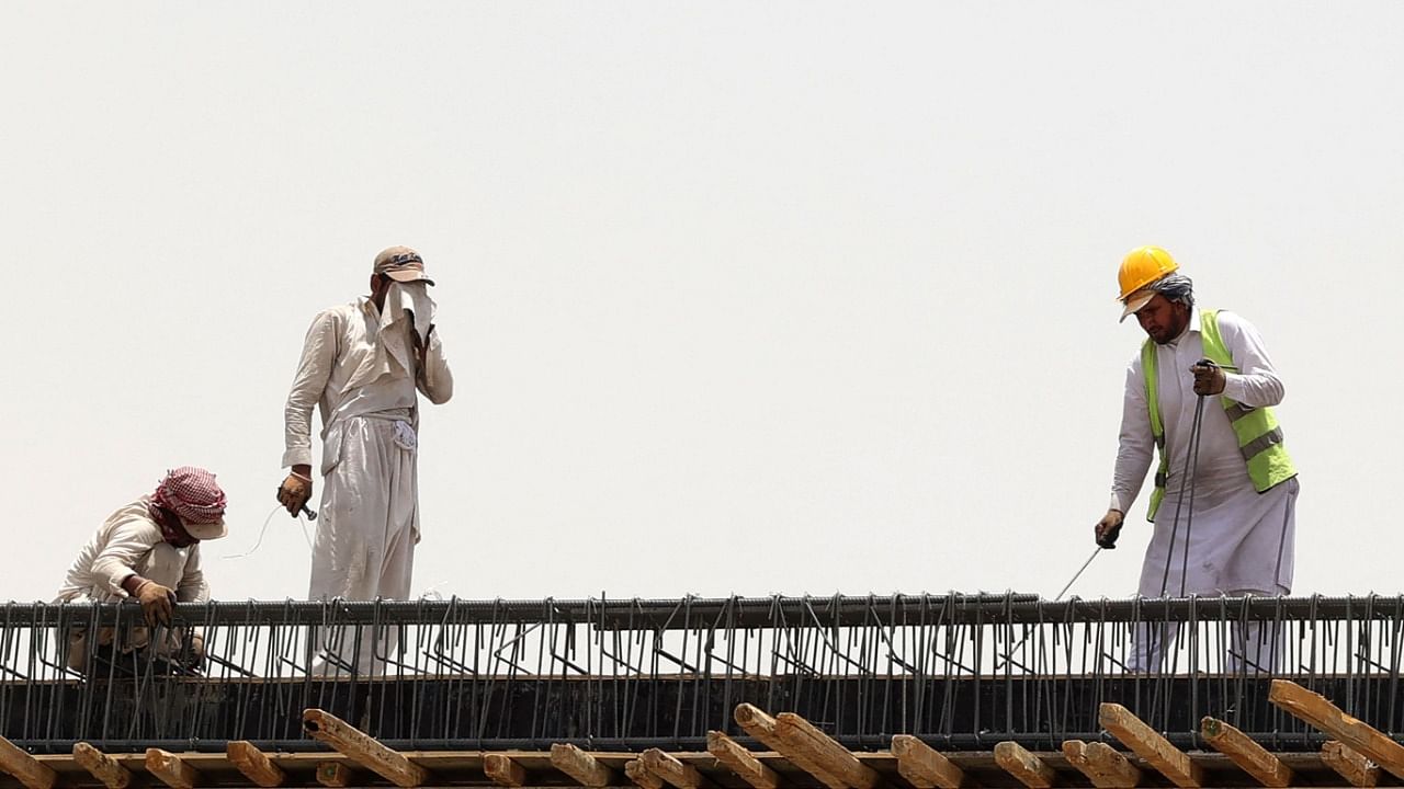 Foreign labourers work at a construction site amid scorching heat in the Saudi capital Riyadh. Credit: AFP Photo