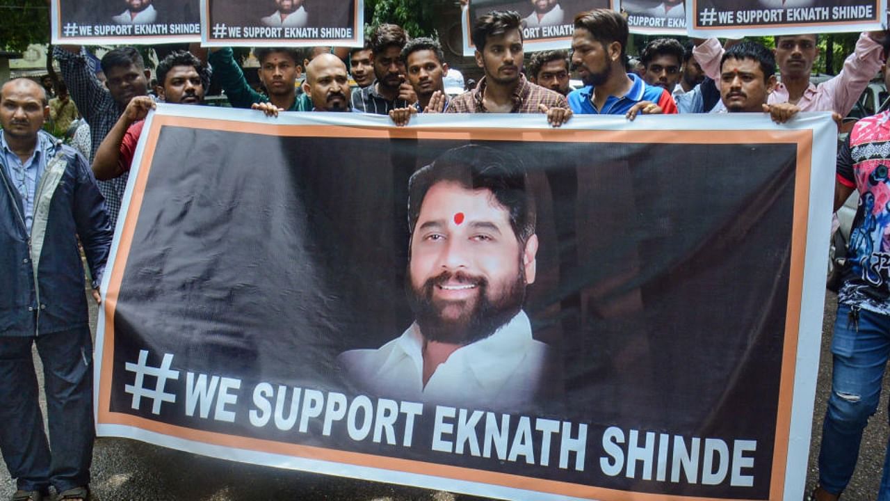 Supporters of rebel Shiv Sena leader Eknath Shinde outside his residence, in Thane, Wednesday, June 22, 2022. Credit: PTI Photo