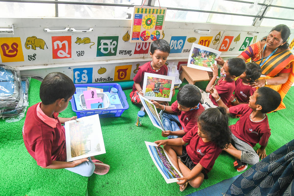 Students learning in Montessori School on Wheels the initiative to talke early learning to doorstep of marginalized children who reside in slums organised by BBMP in association with Freetinking Foundation at Joint Commissioner office. Credit: DH Photo